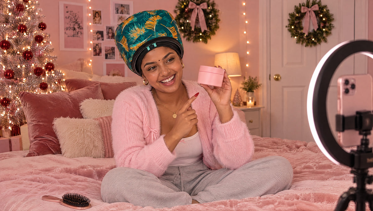Indian content creator filming in her pink bedroom wearing the tropical Team Texture Heat Hat
