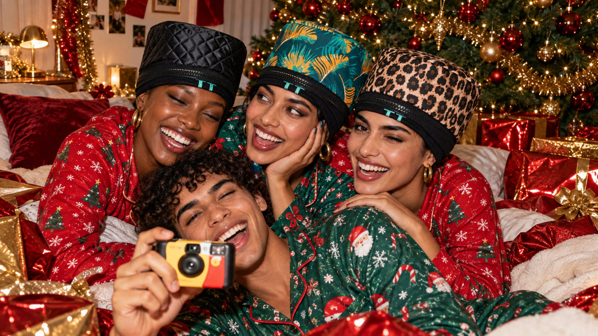 Four friends laughing in Christmas pyjamas wearing Team Texture Heat Hats